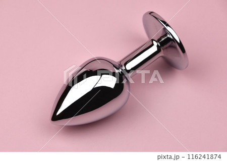 Anal sex concept, anal plug on a black background, butt plug with blue rhinestone, sex toy Anal sex concept, anal plug on a black background, butt plug with blue rhinestone, sex toy 116241874