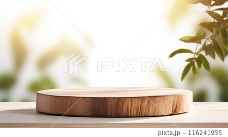 Beautiful round wooden podium, pedestal for an object on a background of lush green grass. Sunlight 116241955