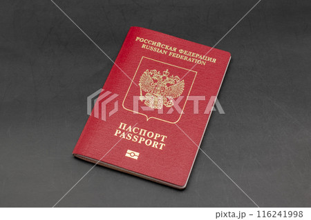 Russian travel passport on a black background, sanctions, emigration, immigration, tourism concept 116241998