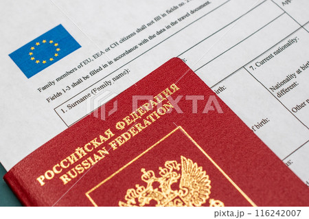 Russian travel passport with Schengen visa application form, sanctions, emigration, immigration, tourism concept 116242007