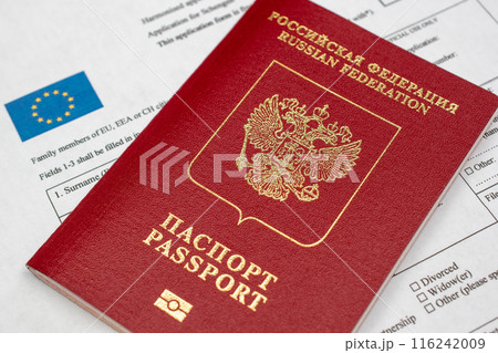 Russian travel passport with Schengen visa application form, sanctions, emigration, immigration, tourism concept Russian travel passport with Schengen visa application form, sanctions, emigration, immigration, tourism concept 116242009