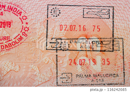 Stamps in a travel passport, entry and exit stamp, emigration, immigration, tourism concept 116242085