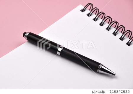 Black pen and notepad on a pink background, notebook with blank sheet Black pen and notepad on a pink background, notebook with blank sheet 116242626