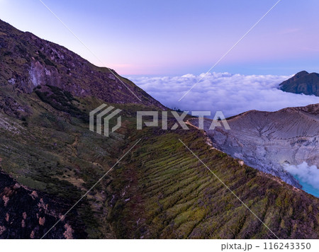 Aerial view Kawah Ijen volcano with turquoise sulfur water lake at sunrise.Amazing nature landscape view at East Java, Indonesia. Natural landscape background 116243350