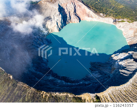 Aerial view Kawah Ijen volcano with turquoise sulfur water lake at sunrise.Amazing nature landscape view at East Java, Indonesia. Natural landscape background Aerial view Kawah Ijen volcano with turquoise sulfur water lake at sunrise.Amazing nature landscape view at East Java, Indonesia. Natural landscape background 116243357