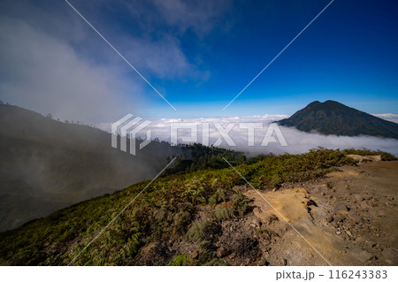 Beautiful landscape view Mountains with fog in sunrise sky at Indonesia 116243383