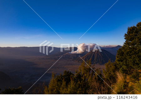 Aerial view Mountains at Bromo volcano during sunrise sky,Beautiful Mountains Penanjakan in Bromo Tengger Semeru National Park,East Java,Indonesia.Nature landscape background Aerial view Mountains at Bromo volcano during sunrise sky,Beautiful Mountains Penanjakan in Bromo Tengger Semeru National Park,East Java,Indonesia.Nature landscape background 116243416