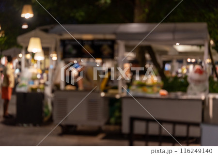 abstract blurred festival food market night light bokeh background. People walking travel street food and stalls 116249140