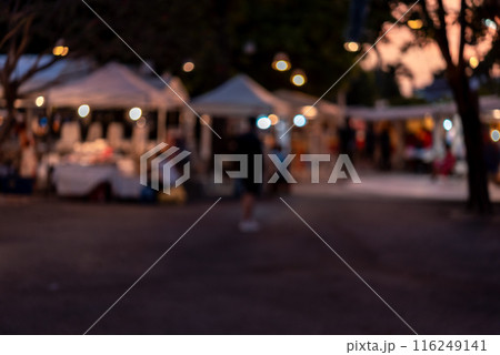 abstract blurred festival food market night light bokeh background. People walking travel street food and stalls abstract blurred festival food market night light bokeh background. People walking travel street food and stalls 116249141