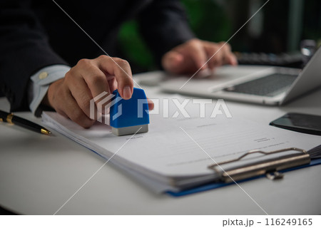 Hand stamping approval on an official document, workflow concept. 116249165