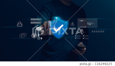 A person is touching a blue shield on a computer screen A person is touching a blue shield on a computer screen 116249225