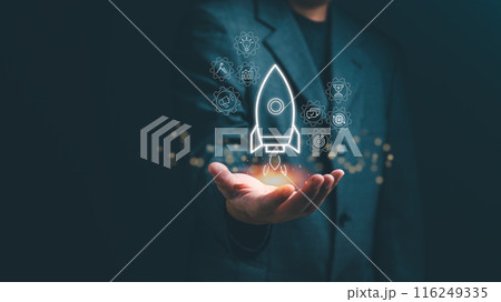 Business professional presenting a holographic startup rocket concept, symbolizing innovation and growth.. 116249335