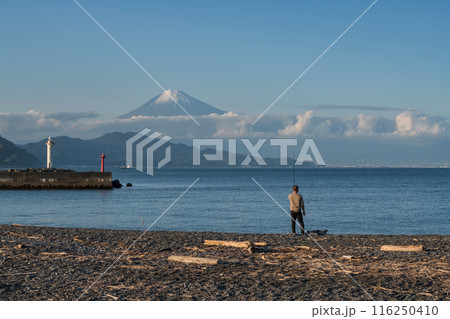 Japanese man fishing on black Miho beach with mt. Fuji, Shimizu 116250410