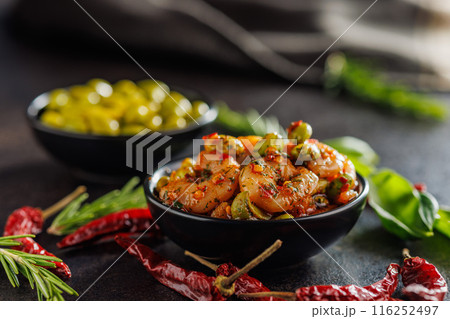 Fresh salad with shrimps and edamame soybeans in bowl on black table. Fresh salad with shrimps and edamame soybeans in bowl on black table. 116252497