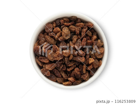 Ceramic bowl with sweet dark raisins made from red grapes isolated on white background. Ceramic bowl with sweet dark raisins made from red grapes isolated on white background. 116253809