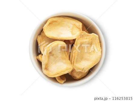 Ceramic bowl with dried breadfruit pieces isolated on white background. 116253815