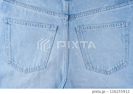 Back side of blue jeans pants, two back pockets close up 116255912