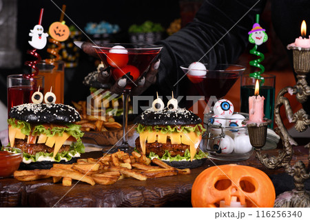 Witch's cocktail with eyeballs in a martini glass 116256340