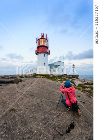 Tourist at Lindesnes Lighthouse in Norway Tourist at Lindesnes Lighthouse in Norway 116257167