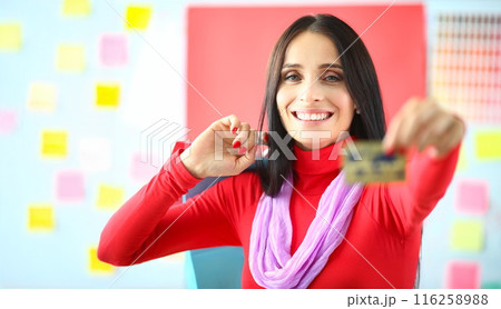 Smiling woman hold credit card, best option for contactless payment, saveup money 116258988