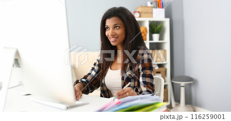 Smiling afro american woman on workplace, work as secretary, student on remote education 116259001