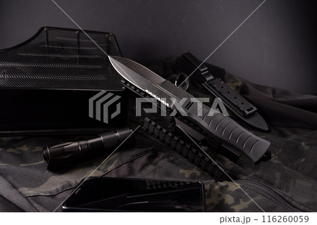 Large military knife. Military accessories and knife. Military composition on a black background. 116260059