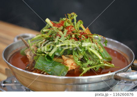 Korean fish stew made with plenty of red pepper powder and seasoned with various vegetables 116260876