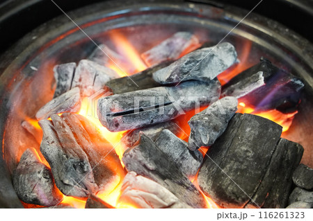 Charcoal fire burning for barbecue 116261323