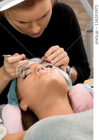 Procedure of eyelashes extension in beauty salon Procedure of eyelashes extension in beauty salon 116263972