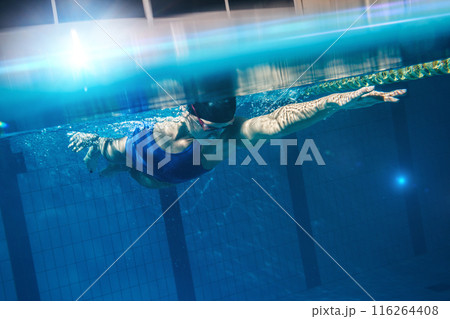 Swimmer woman underwater during her workout in the pool 116264408