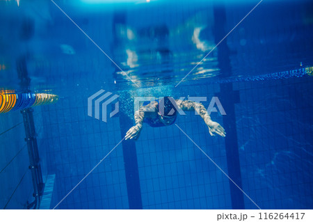 Swimmer woman underwater during her workout in the pool 116264417