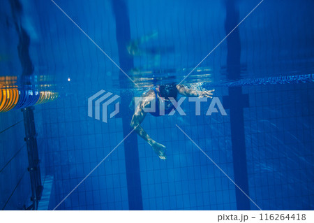 Swimmer woman underwater during her workout in the pool 116264418