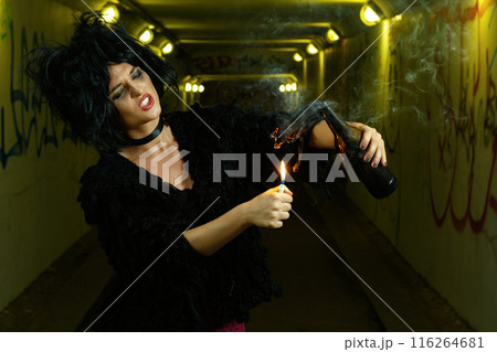 Freaky woman in dark tunnel with bottle bomb 116264681