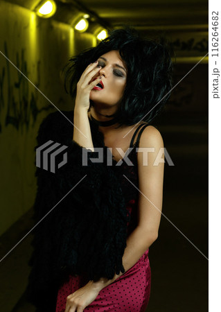 Strange and freaky woman in dark underground Strange and freaky woman in dark underground 116264682