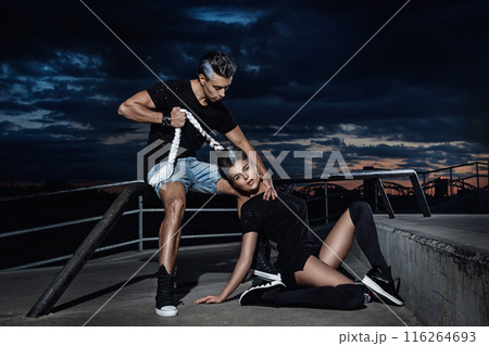 Stylish couple in the skate park at night Stylish couple in the skate park at night 116264693