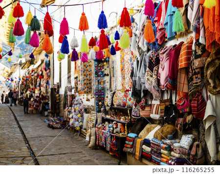 Colorful alley with handmade souvenirs in traditional Pisac market, Cusco region, Peru 116265255