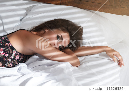 Sexy woman lying on the bed at the morning Sexy woman lying on the bed at the morning 116265264