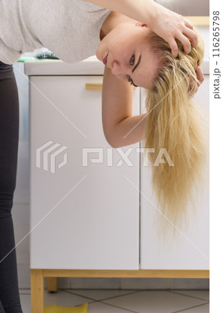 Female having problem with blonde hair Female having problem with blonde hair 116265798