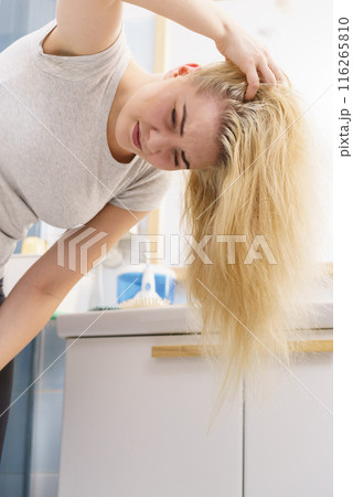 Female having problem with blonde hair Female having problem with blonde hair 116265810