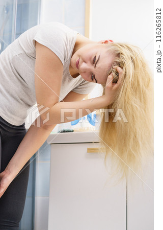 Female having problem with blonde hair Female having problem with blonde hair 116265812
