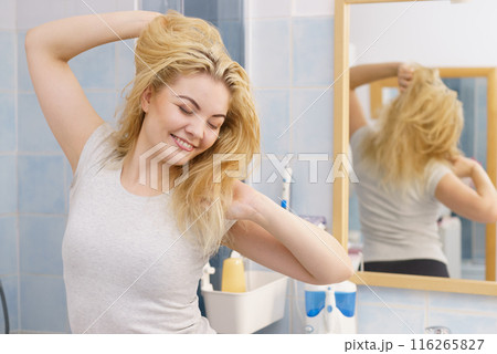 Happy fresh blonde woman in bathroom Happy fresh blonde woman in bathroom 116265827