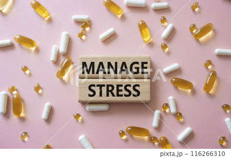 Manage stress symbol. Concept word Manage stress on wooden blocks. Beautiful pink background with pills. Medicine and Manage stress concept. Copy space 116266310
