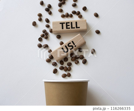 Tell us symbol. Concept words Tell us on wooden blocks. Beautiful white background with coffee cup. Business and Tell us concept. Copy space. 116266335