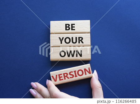 Be your own version symbol. Concept words Be your own version on wooden blocks. Businessman hand. Beautiful deep blue background. Business and Be your own version concept. Copy space Be your own version symbol. Concept words Be your own version on wooden blocks. Businessman hand. Beautiful deep blue background. Business and Be your own version concept. Copy space 116266485