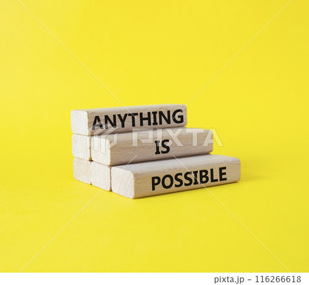 Anything is Possible symbol. Wooden blocks with words Anything is Possible. Beautiful yellow background. Business and Anything is Possible concept. Copy space. 116266618