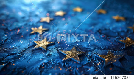 Golden Stars on Textured Blue Background. Golden stars scattered on a textured blue background, creating a dreamy and festive visual with sparkling accents. 116267085
