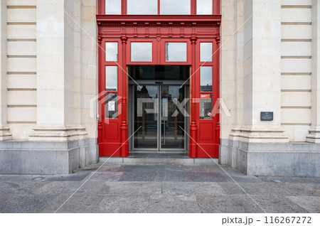 Leuven, Flanders, Belgium - Red entrance door of the railway station 116267272