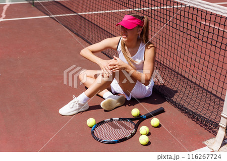 a young tennis player was injured while playing tennis, big tennis concept, sports injuries 116267724