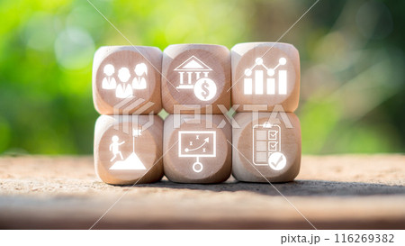 Wooden blocks with business icons illustrating Employee Stock Ownership Plans, financial growth, teamwork, and strategic planning. 116269382