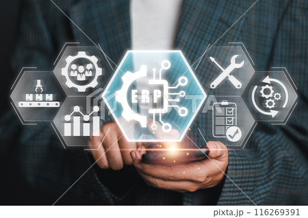 Businessman interacting with ERP icons on a digital interface, representing integrated business management solutions and technology. 116269391